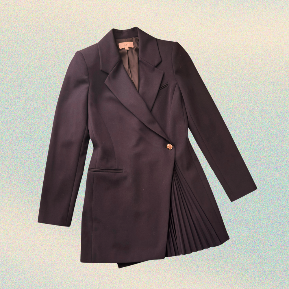 Dark purple blazer with pleated detail on a gradient background