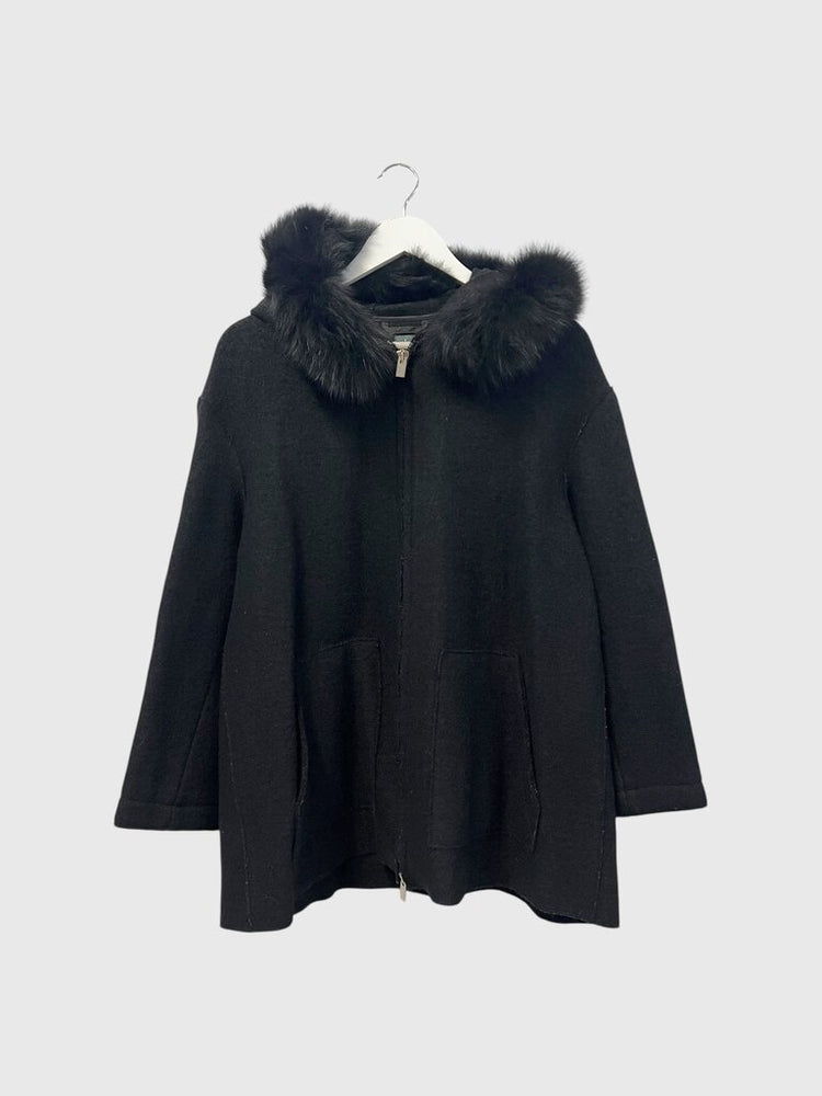 Black coat with fur hood on a white background