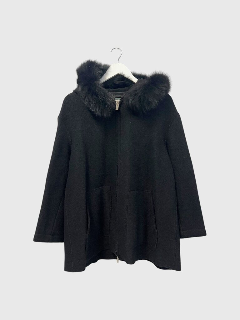 Black coat with fur hood on a white background