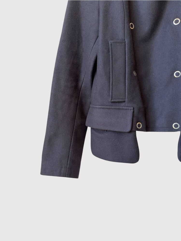 
                  
                    Detailed view of left sleeve and pocket on Maison Margiela Wool Grommet Snaps jacket, featuring flap pocket and clean stitching.
                  
                