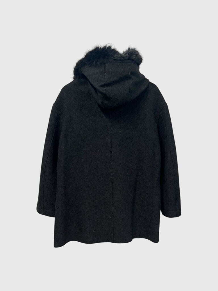 Black coat with fur hood on a light gray background