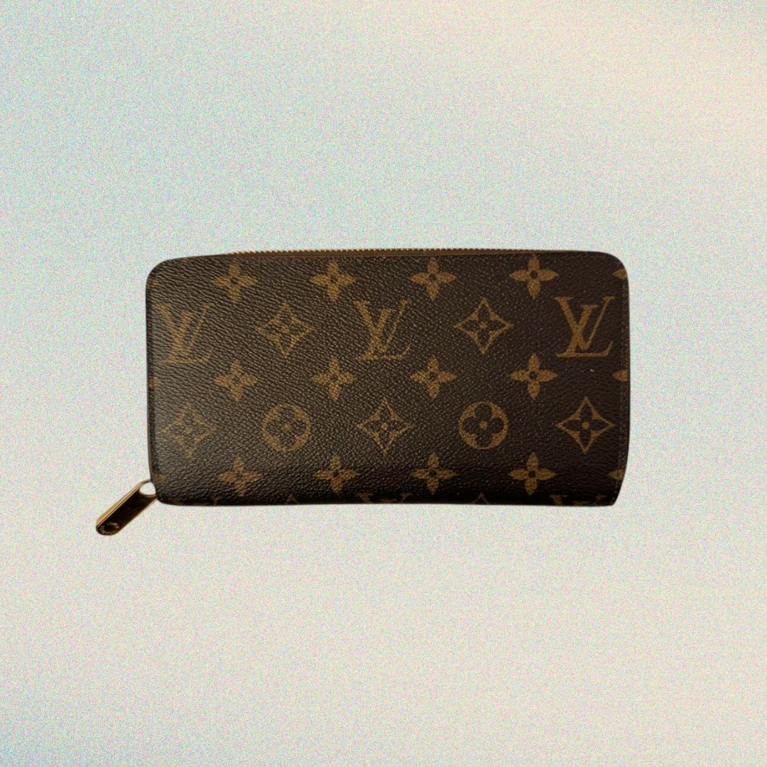 Brown wallet with monogram pattern on a light background